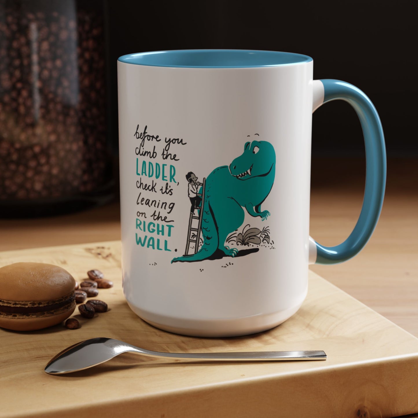 Blue accent dinosaur motivational mug on desk - funny coffee cup lifestyle