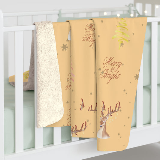 Three Christmas-themed blankets with reindeer and text on a white crib.