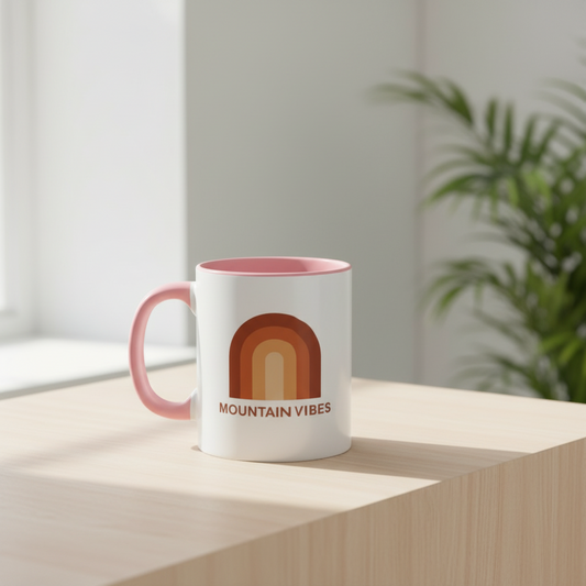 Mountain Vibes retro rainbow coffee mug with pink interior and handle on white background
