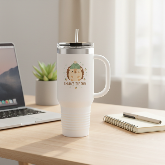 Embrace the Cozy hedgehog tumbler on wooden desk next to laptop - cozy work essential