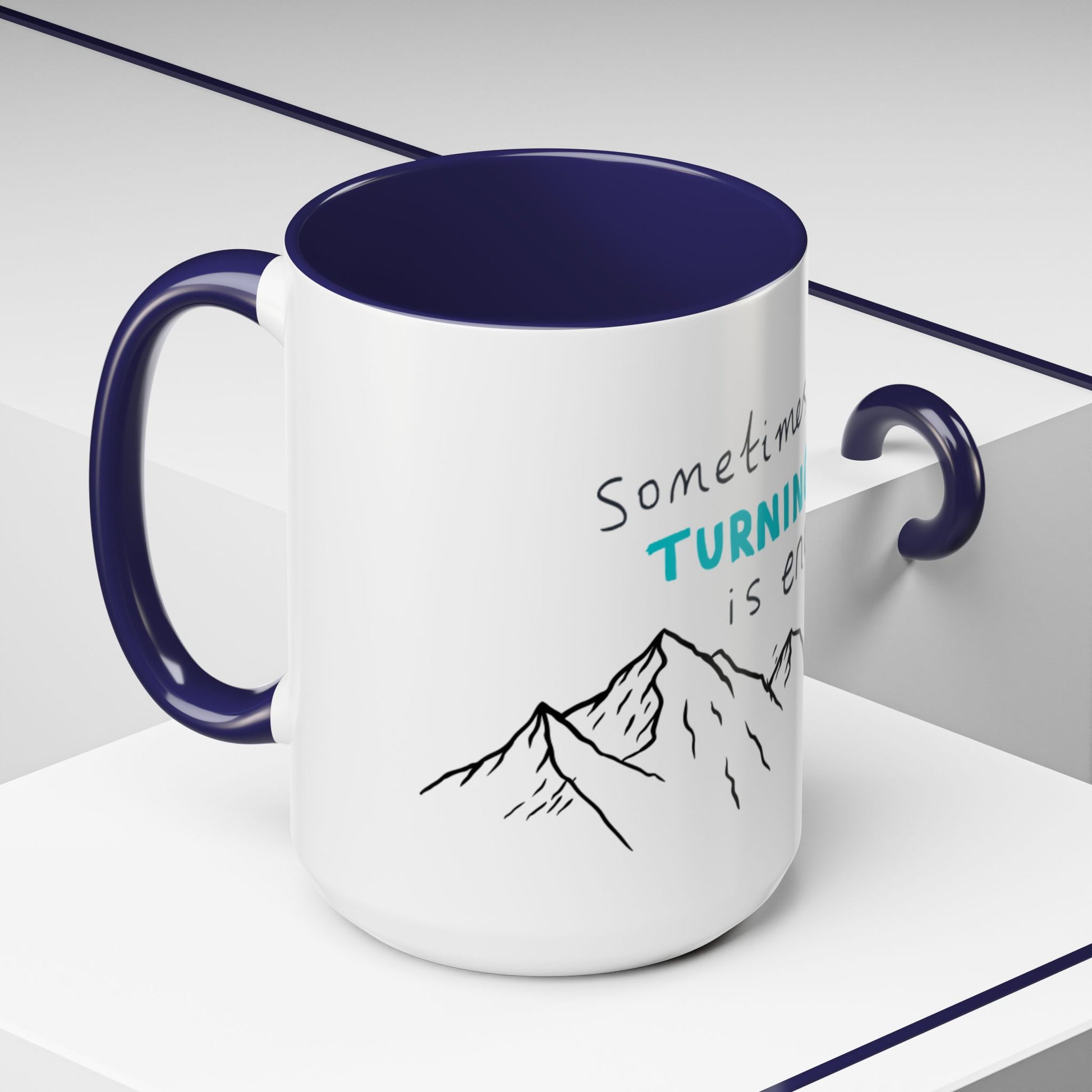 White ceramic mug with navy blue interior and handle - Sometimes Turning Up is Enough mountain quote coffee cup