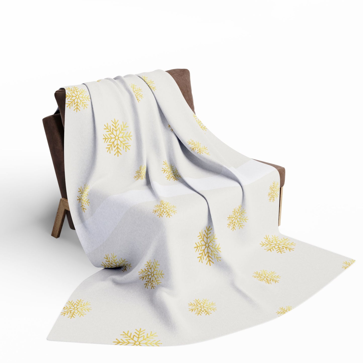 White blanket with yellow floral patterns draped over a wooden chair on a white background