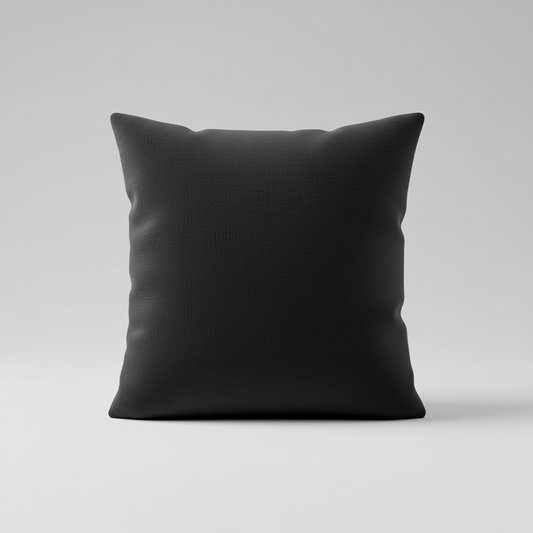 Black square plump pillow on grey background